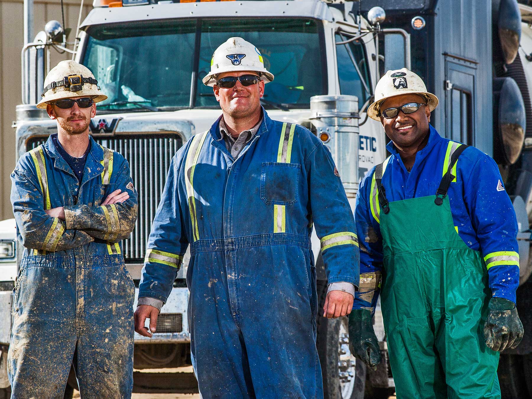 smiling hydrovac workers